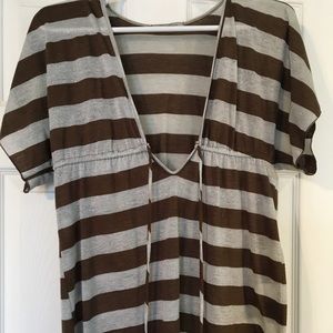 Brown and silver striped shirt. Ties in front